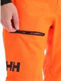 Miniatura Helly Hansen, Sogn Cargo pantalones de esquí hardshell hombres neon naranja 